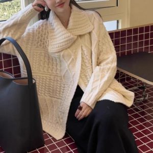 Women's autumn and winter cozy cable knit cardigan with oversized collar and a relaxed, raccoon fleece knit style.