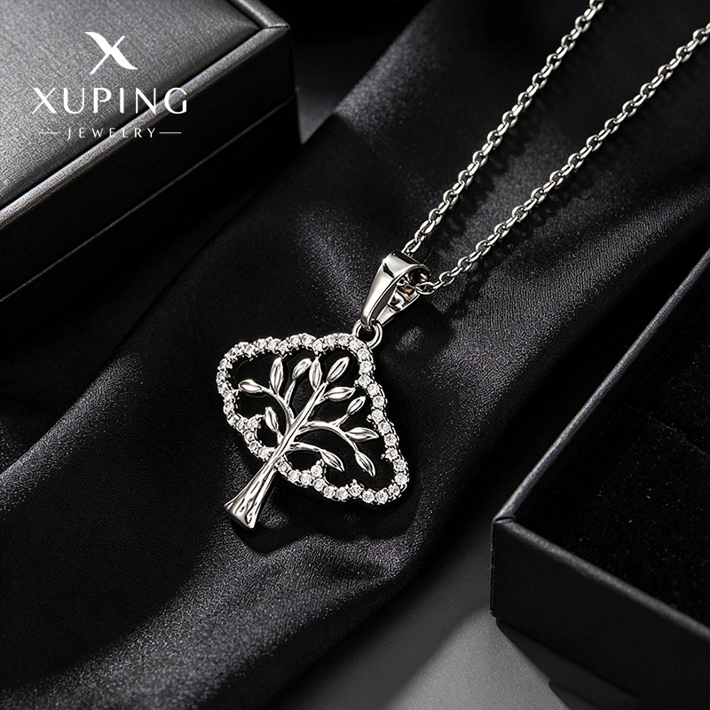 Xuping's new European and American cross-border artificial gemstone hollow tree necklace pendant, a casual and unique design.