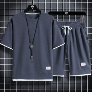 Shirts and clothing waffle sports casual suits for men spot wholesale Hong Kong style loose fake two-piece short-sleeved shorts